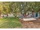 Peaceful backyard with a hammock under a shady tree at 10876 Maple Rd, Lafayette, CO 80026