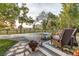 Relaxing patio furniture overlooks a fenced-in yard with distant mountain views at 10876 Maple Rd, Lafayette, CO 80026