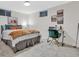Bright finished basement bedroom with a comfy bed and workspace at 10876 Maple Rd, Lafayette, CO 80026
