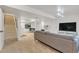 Finished basement with a comfortable living area and large TV at 10876 Maple Rd, Lafayette, CO 80026