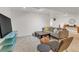 Finished basement recreation area with comfortable seating and large TV at 10876 Maple Rd, Lafayette, CO 80026