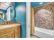 Bright bathroom with a tiled shower and golden vanity at 10876 Maple Rd, Lafayette, CO 80026