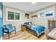 Charming bedroom featuring light wood floors and a space-themed decor at 10876 Maple Rd, Lafayette, CO 80026