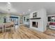 Light-filled dining room with hardwood floors and a charming table setting at 10876 Maple Rd, Lafayette, CO 80026