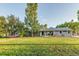 Charming ranch house with a covered patio and expansive lawn at 10876 Maple Rd, Lafayette, CO 80026