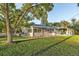 Ranch home with mature trees and a large front yard at 10876 Maple Rd, Lafayette, CO 80026