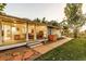 Charming ranch house with a large covered porch and well-maintained landscaping at 10876 Maple Rd, Lafayette, CO 80026