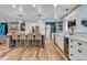 Modern kitchen with white cabinetry, stainless steel appliances, and an island at 10876 Maple Rd, Lafayette, CO 80026