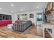 Spacious living room featuring a gray sectional sofa and hardwood floors at 10876 Maple Rd, Lafayette, CO 80026