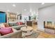 Bright and airy living room with a cozy fireplace and open floor plan at 10876 Maple Rd, Lafayette, CO 80026