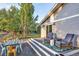 Relaxing patio area with comfortable seating and a wooden table at 10876 Maple Rd, Lafayette, CO 80026