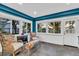 Sunroom with two wicker armchairs and a view of the property at 10876 Maple Rd, Lafayette, CO 80026