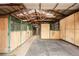 Spacious barn interior with multiple stalls, wooden walls, and metal framing at 5351 Tall Horse Trl, Sedalia, CO 80135