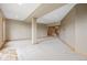 Large finished basement offering ample space for entertaining, a play area, and a staircase at 5351 Tall Horse Trl, Sedalia, CO 80135