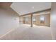 Finished basement with neutral carpet and windows; versatile space for recreation or living at 5351 Tall Horse Trl, Sedalia, CO 80135