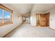 Spacious bedroom with natural light, walk-in closet, and sliding glass doors to the balcony at 5351 Tall Horse Trl, Sedalia, CO 80135