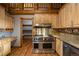 Spacious kitchen featuring wood cabinets, stainless steel appliances and a walk-in pantry at 5351 Tall Horse Trl, Sedalia, CO 80135