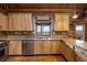 Kitchen featuring light wood cabinets, stone countertops, and stainless steel appliances at 5351 Tall Horse Trl, Sedalia, CO 80135