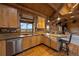 Rustic kitchen offers views of the beautiful, mountainous landscape at 5351 Tall Horse Trl, Sedalia, CO 80135