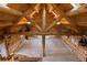 Stunning log cabin interior featuring vaulted ceilings, exposed beams, and a spacious layout with unique decor and ample natural light at 5351 Tall Horse Trl, Sedalia, CO 80135