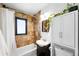 Bathroom features tiled shower and large white vanity, with lots of natural light at 1240 Ulster St, Denver, CO 80220