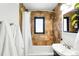 Bathroom features a tiled shower with white vanity, and built-in shelf space at 1240 Ulster St, Denver, CO 80220
