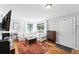 Bright living room with stylish decor, hardwood floors, and plenty of natural light at 1240 Ulster St, Denver, CO 80220