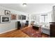 Inviting living room with hardwood floors, stylish decor, and abundant natural light at 1240 Ulster St, Denver, CO 80220