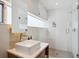 Modern bathroom features sleek fixtures, glass shower, and elegant tiling at 35 S Forest St, Denver, CO 80246