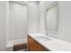 Modern bathroom with a white vanity, sleek fixtures, and a tiled shower-over-tub at 35 S Forest St, Denver, CO 80246