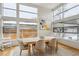 Dining room with a modern chandelier, a large window, and a table with seating for six at 35 S Forest St, Denver, CO 80246