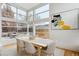 Bright dining room with a view and modern lighting at 35 S Forest St, Denver, CO 80246