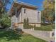 Well-maintained exterior of a modern residence with a unique concrete facade and mature trees surrounding the property at 35 S Forest St, Denver, CO 80246