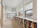 Bright hallway featuring full wall bookshelves and large windows providing lots of natural light at 35 S Forest St, Denver, CO 80246