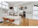 Contemporary kitchen with a breakfast bar, stainless steel appliances, and unique artwork at 35 S Forest St, Denver, CO 80246