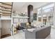 Stylish living room featuring a modern metal fireplace, with views of the staircase, upstairs landing and art at 35 S Forest St, Denver, CO 80246