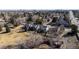 An aerial shot shows a neighborhood with lush trees and green spaces in close proximity to urban buildings at 3311 E Euclid Ave, Centennial, CO 80121