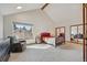 Bedroom with vaulted ceilings, large windows and mirrored closet doors for a light and airy feel at 3311 E Euclid Ave, Centennial, CO 80121