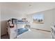 Bedroom featuring a bunk bed and a bright window offering a comfortable and playful atmosphere at 3311 E Euclid Ave, Centennial, CO 80121