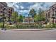 The Southglenn Fountain in a roundabout surrounded by flowers, businesses, and a beautiful summer sky at 3311 E Euclid Ave, Centennial, CO 80121