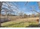 Lush green yard bordered by a classic wooden fence and mature trees at 3311 E Euclid Ave, Centennial, CO 80121