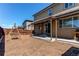 Spacious backyard with a covered patio and play set for outdoor enjoyment at 25046 E Bayaud Pl, Aurora, CO 80018