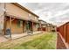 Fenced backyard features a covered patio, shed, and lush lawn at 25046 E Bayaud Pl, Aurora, CO 80018
