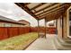 Covered patio and lawn in a fully fenced backyard at 25046 E Bayaud Pl, Aurora, CO 80018