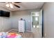 Bedroom with ceiling fan, television, closet, and view into the hallway from the doorway at 25046 E Bayaud Pl, Aurora, CO 80018