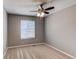 Bedroom with large window, neutral walls, and plush carpet provides a blank canvas for your personal touch at 25046 E Bayaud Pl, Aurora, CO 80018