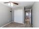 Bedroom includes a closet, ceiling fan, and doorway leading into the bathroom and closet at 25046 E Bayaud Pl, Aurora, CO 80018