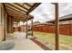 Covered patio provides an outdoor living space and views of the fenced backyard at 25046 E Bayaud Pl, Aurora, CO 80018