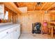 Shed interior with unfinished walls, shelving, and rolling utility carts to store lawn and garden tools at 25046 E Bayaud Pl, Aurora, CO 80018