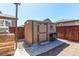Backyard shed with a side countertop on a brick foundation provides great outdoor storage at 25046 E Bayaud Pl, Aurora, CO 80018
